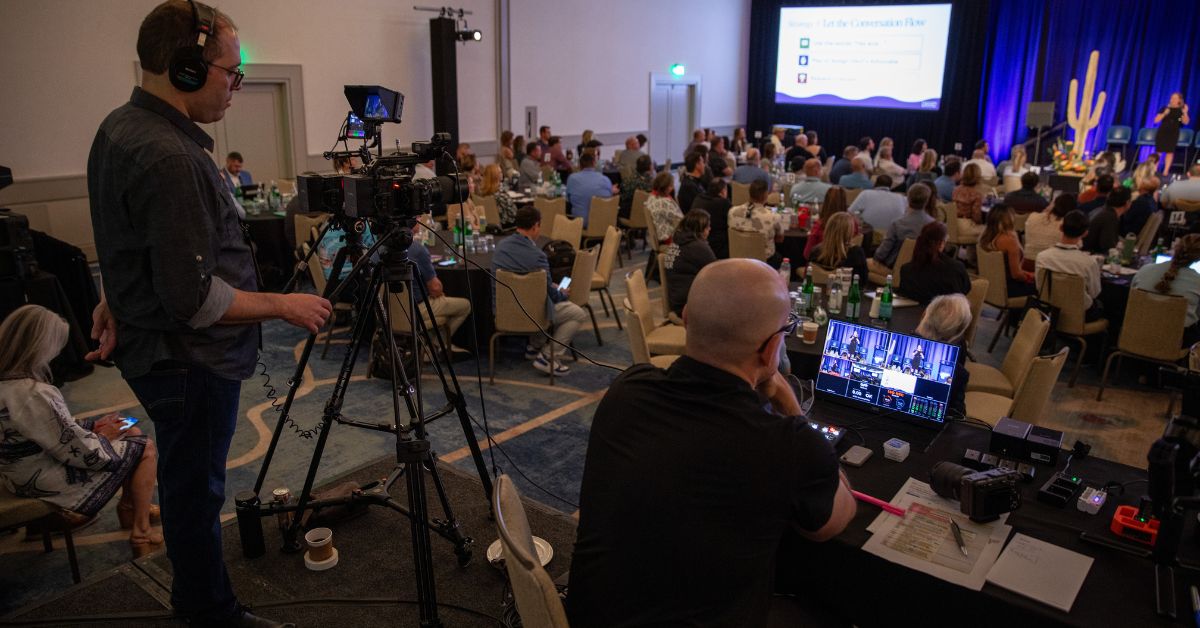Behind-the-scenes of the Lumedia Creative production team filming keynote presentations and capturing conference content during Troon's Fusion Forum corporate event.